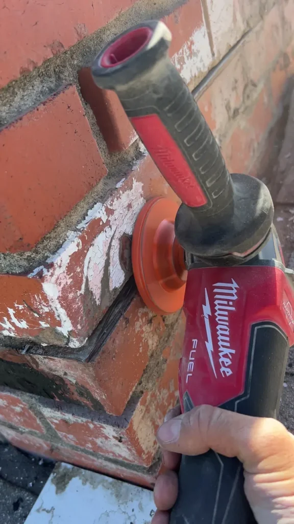 Preparing the brickwork and channel for replacement chimney flashing