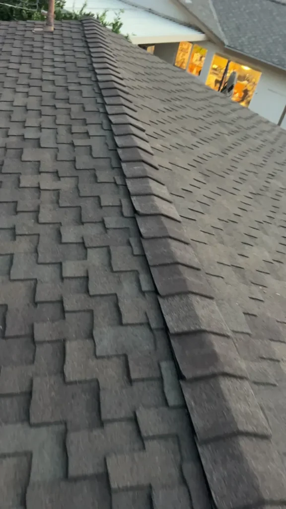 Completed shingle ridge cap on a separate Home Repairman roof project