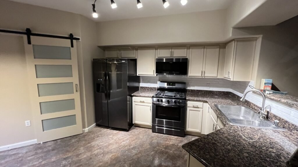 Kitchen cabinets after preparation and a lighter painted finish