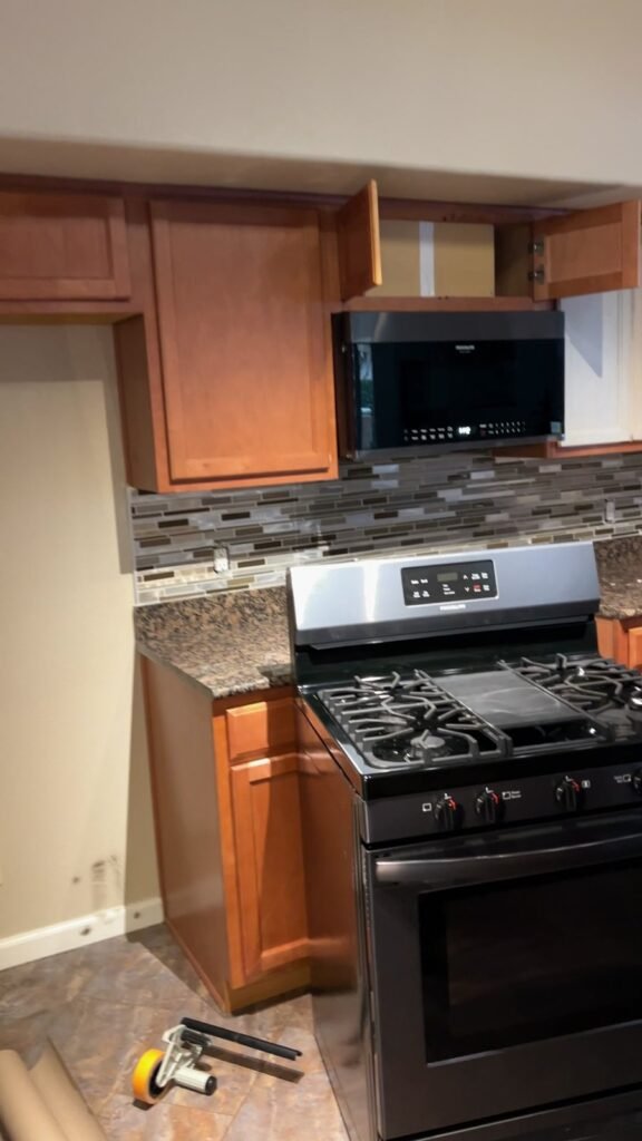 Original darker kitchen cabinets before refinishing